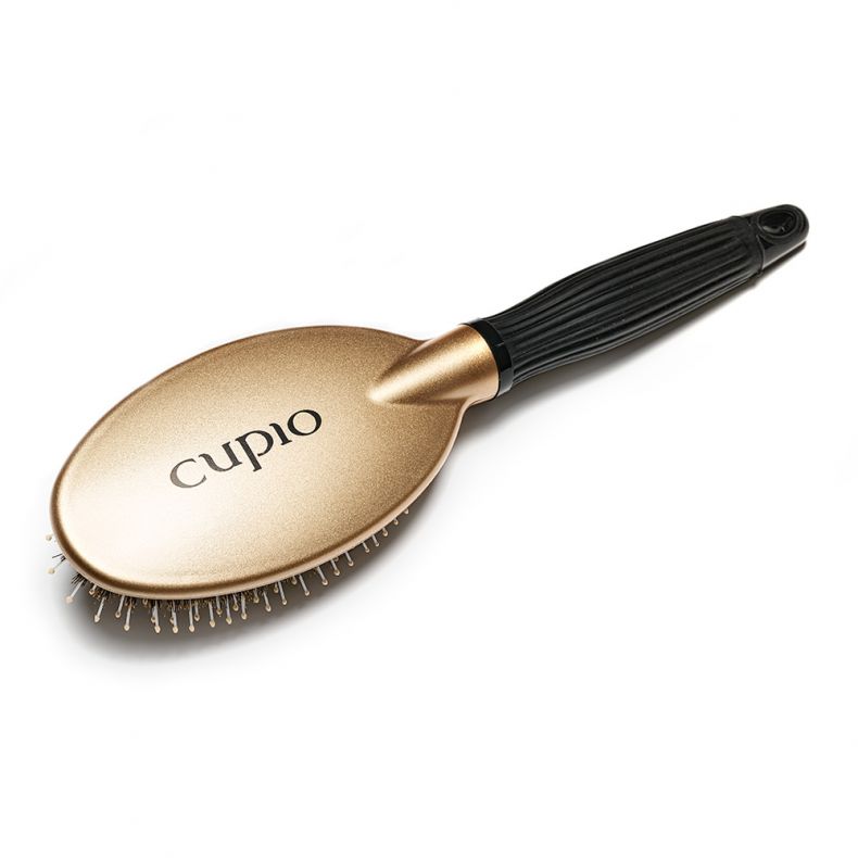 Elegante Cupio Haarbürste in goldfarbenem Design mit ergonomischem Griff