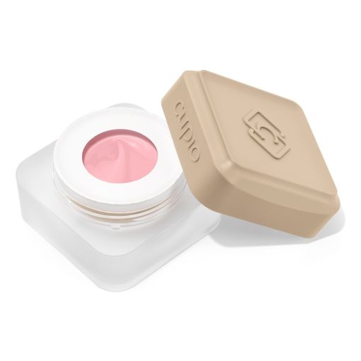 Offener Tiegel mit rosa Creme und beigem Deckel
