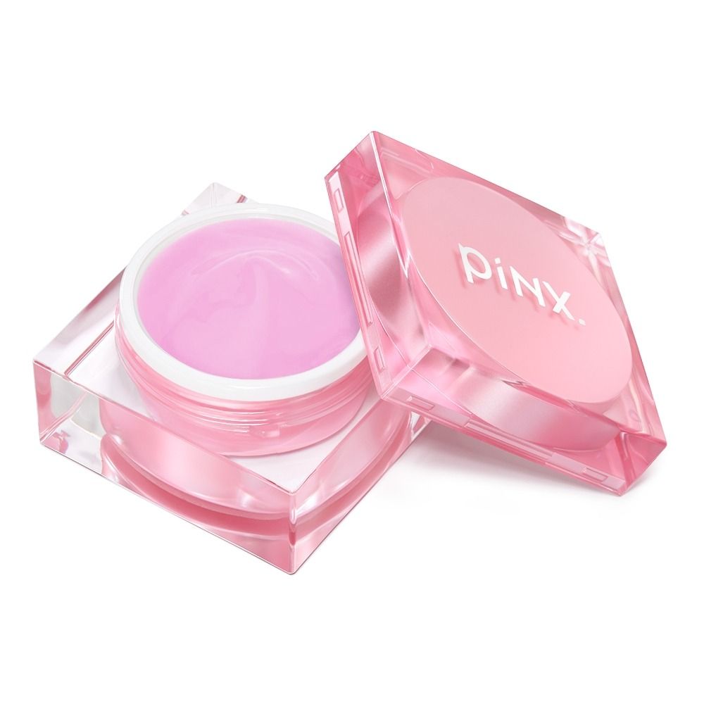 Offener rosa PiNX Creme-Tiegel mit Deckel daneben