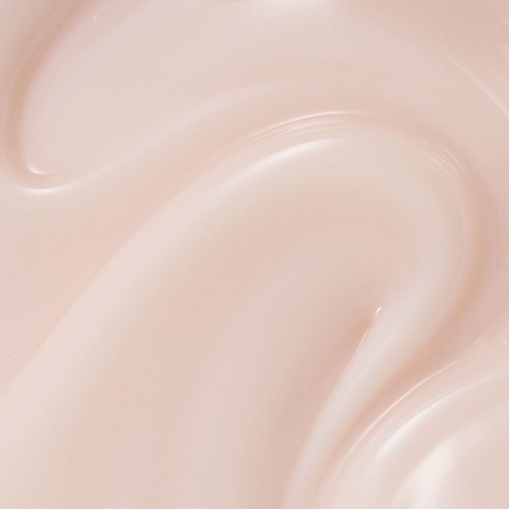 Zart roséfarbene Creme- oder Lotion-Textur in Nahaufnahme, ideal zur Darstellung von Hautpflege und Kosmetikprodukten