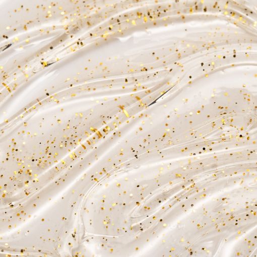 Nahaufnahme einer transparenten Gel-Textur mit feinen goldenen Glitzerpartikeln als Darstellung eines kosmetischen Pflegeprodukts