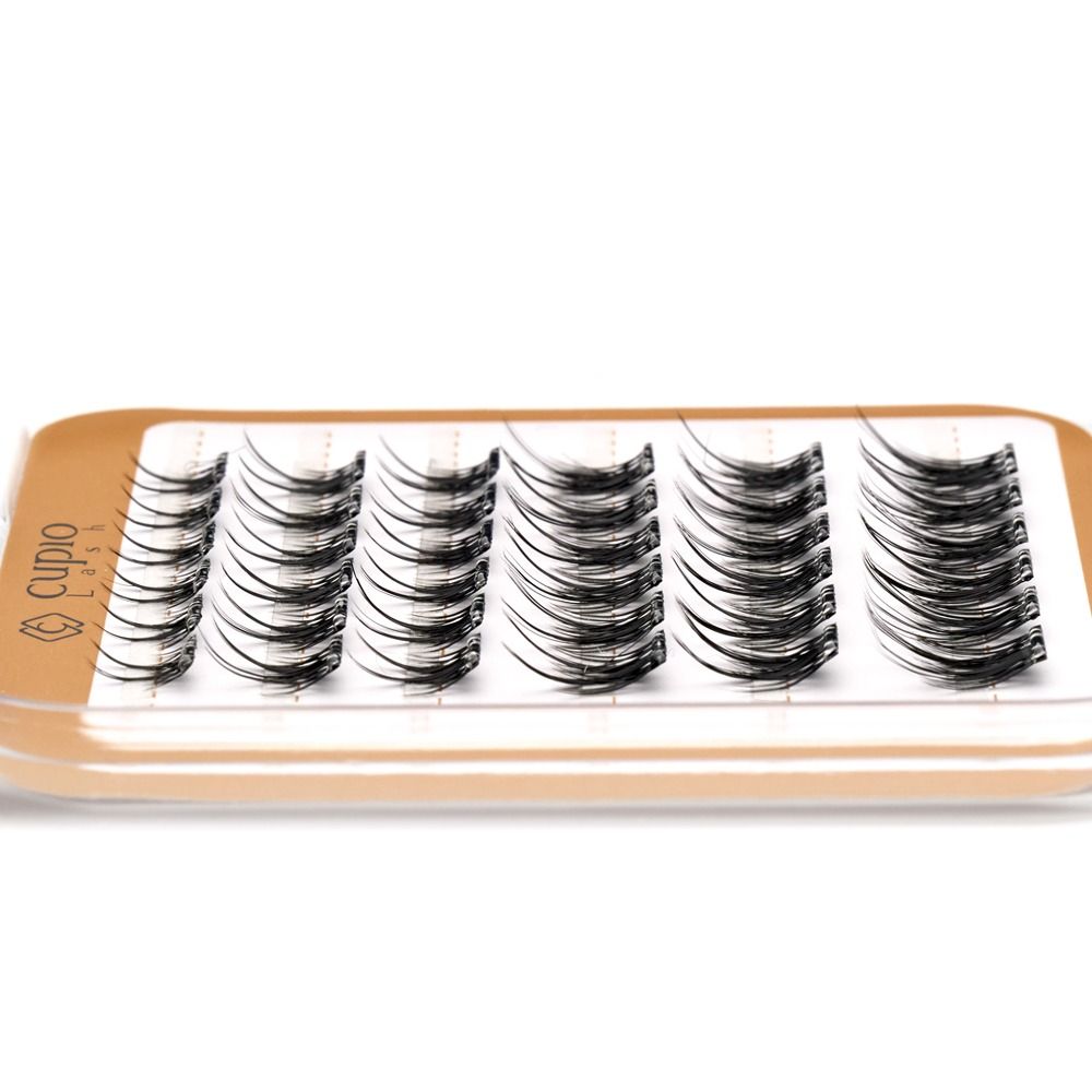Nahaufnahme von Cupio Lashes Wimpernbüscheln auf einem Tray, künstliche Einzelwimpern für professionelle Wimpernverlängerung und mehr Volumen