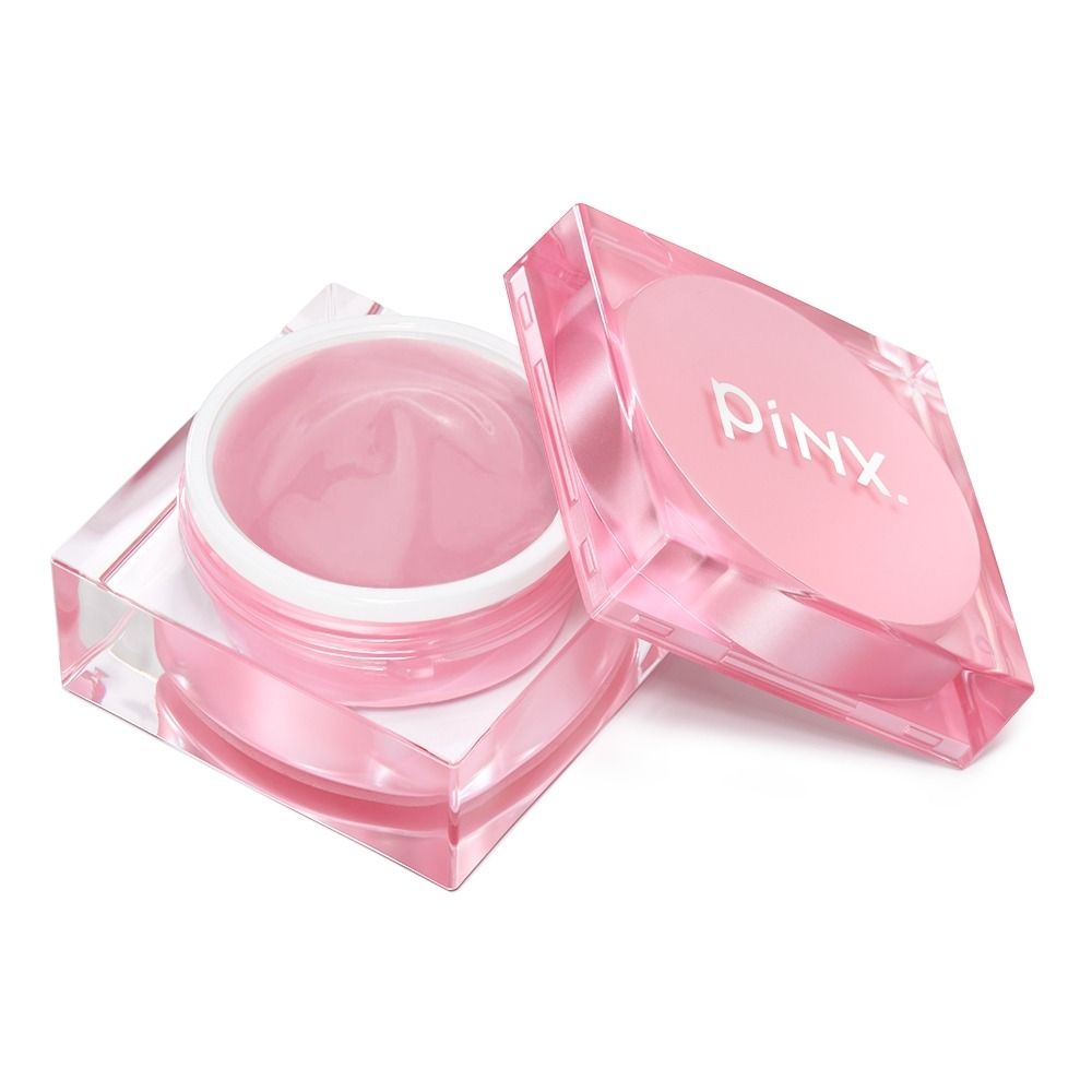Doppelt verpackte pinke Gesichtscreme in eleganter Dose