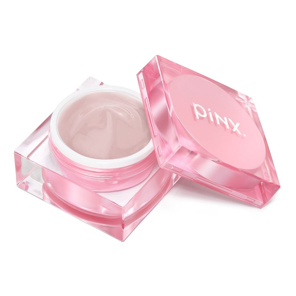 Geöffneter PINK. Cremetiegel in transparenter rosa Kosmetikdose mit Deckel auf weißem Hintergrund
