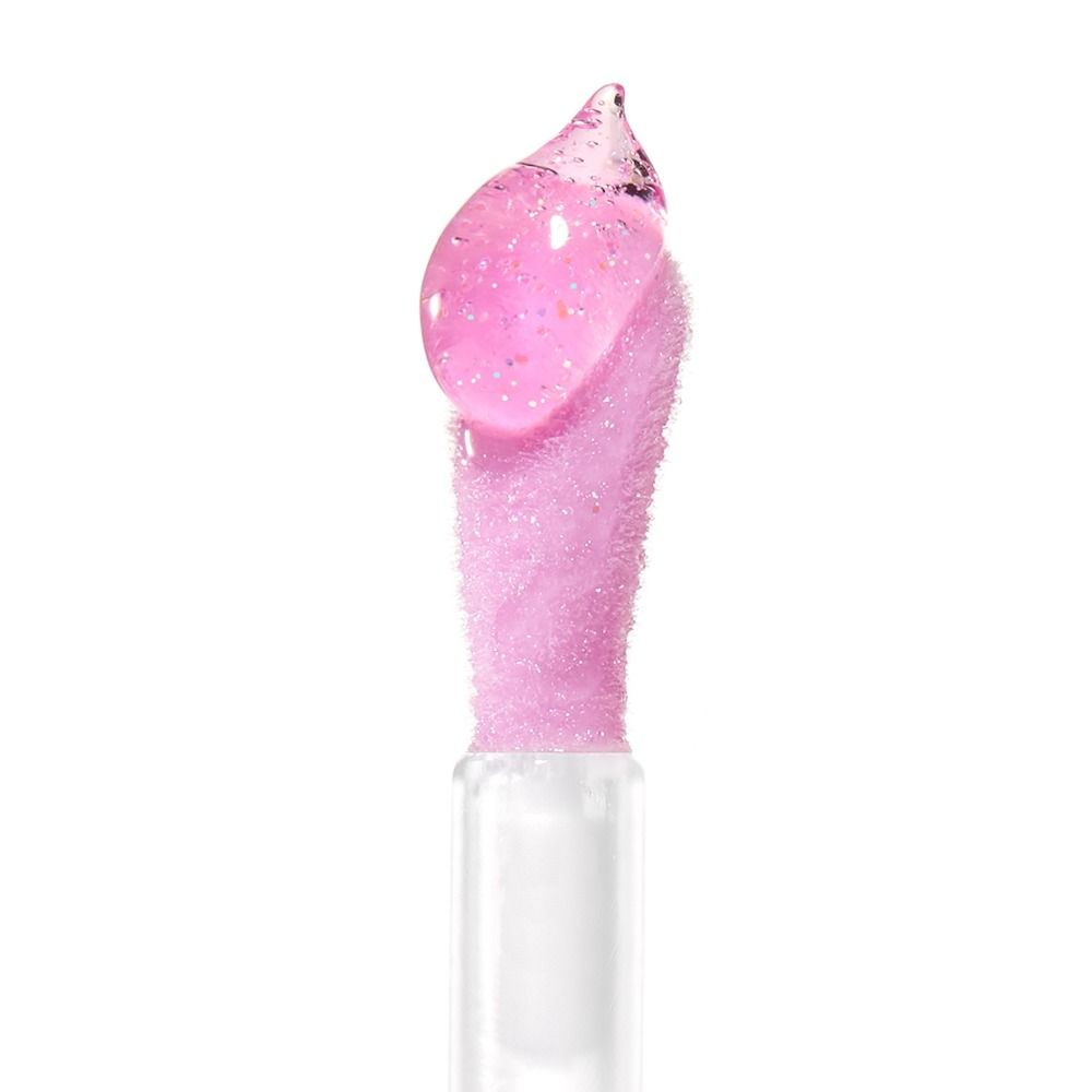 Nahaufnahme eines glitzernden Lippenbalsams mit pinker Farbe und transparenten Blubberblasen