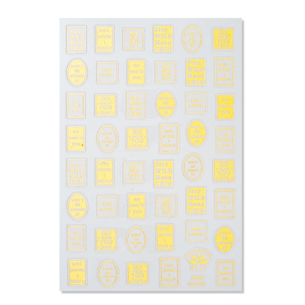 Aufkleberbogen mit verschiedenen Sprüchen in goldener Schrift auf grauem Hintergrund